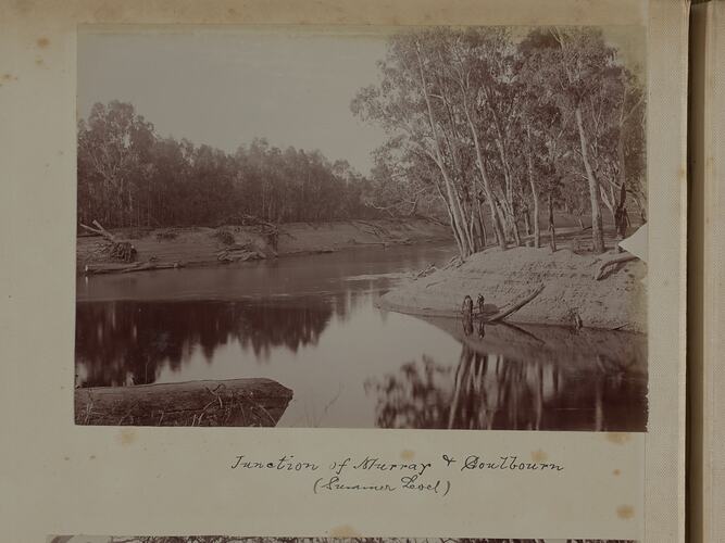 Junction of two rivers. Both are very low. Dismounted male rider, with horse drinking on riverbank at right. Text below.