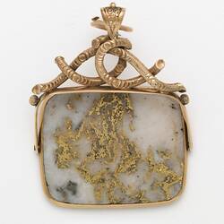 Rectangular pendant featuring white gold-bearing quartz in a gold setting, complimented by a delicate branch-like motif at the top.