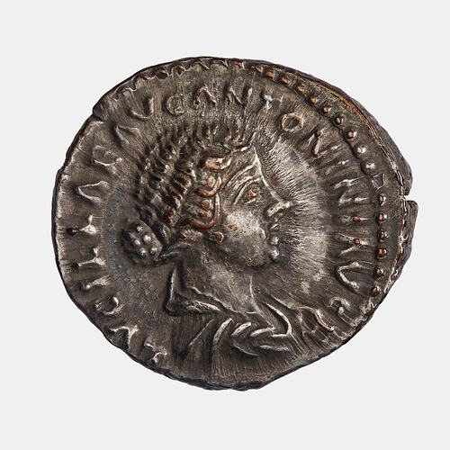 Roughly round coin. Draped female bust facing right. Text around.