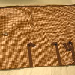 Horse blanket, brown and white pattern fabric.