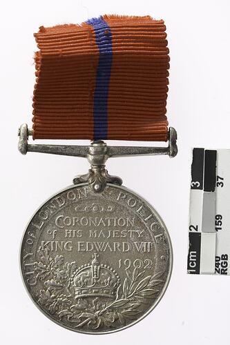Medal with red ribbon.