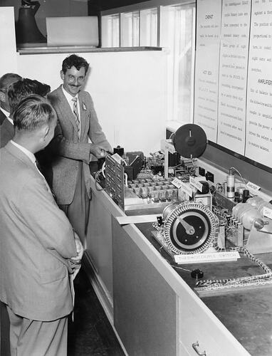 Tery Holden demonstrating multi point digital temperature recorder, c1958