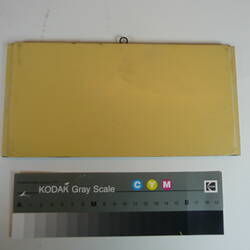 Painted board showing sample of colour yellow.