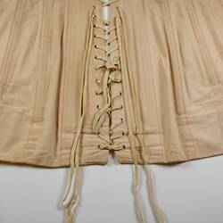 Lace detail of pink girdle.