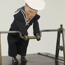 Mechanical amusement with little sailor men.