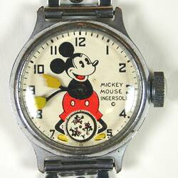 Watch, circular white dial, central Mickey, black numerals, three Mickey's minute disk at six, metal band.