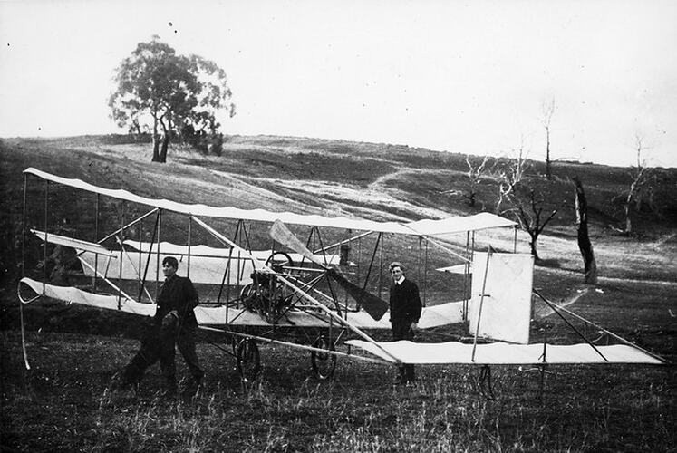 J.R. Duigan & Reg Duigan, with biplane, 1910