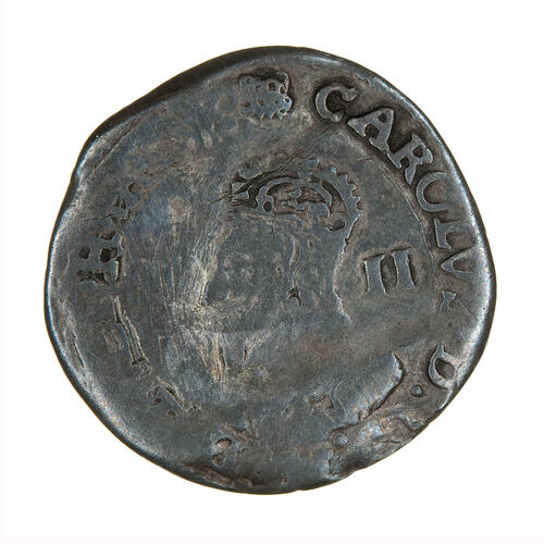 Coin, round, Within an inner line circle, the crowned and draped bust of King facing left; text around.
