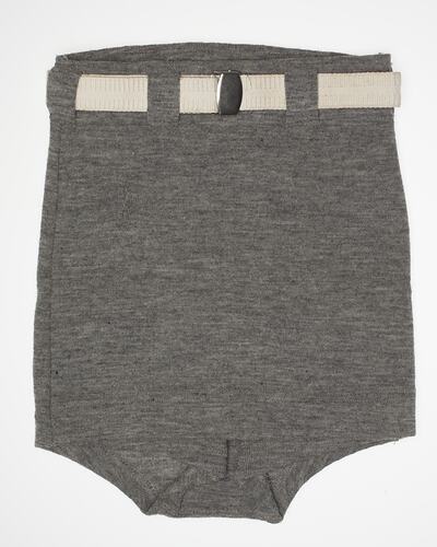 Grey cut-off shorts with a white belt.