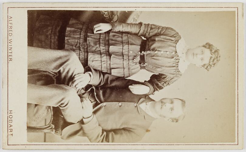 Man seated and woman standing.