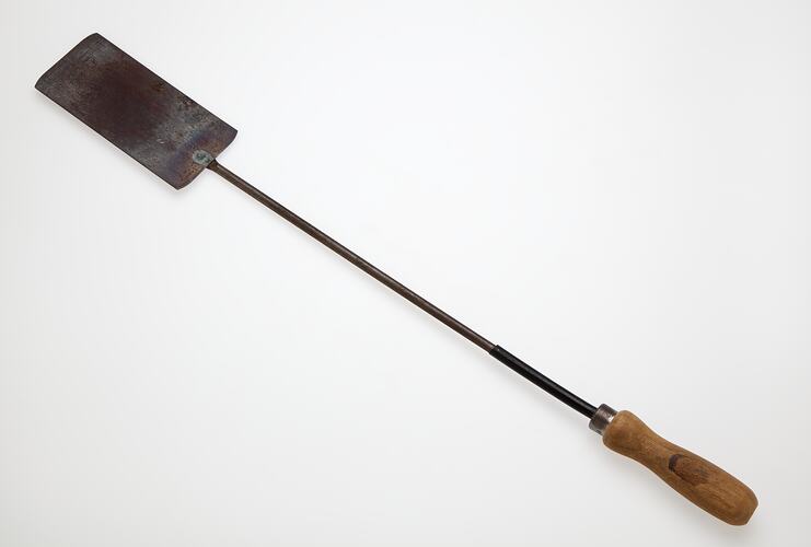 Metal spatula with wooden handle.