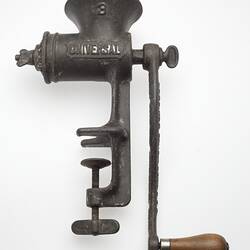 Vintage sausage maker with wooden crank handle.