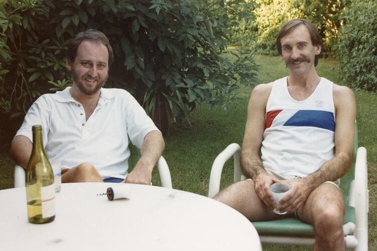 Two Men Sharing Bottle of Wine in Backyard, circa 1988