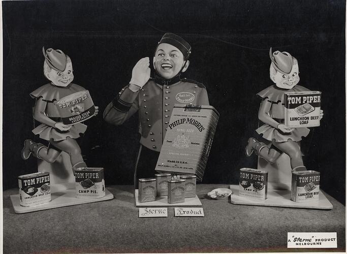 Three advertising displays with dolls.