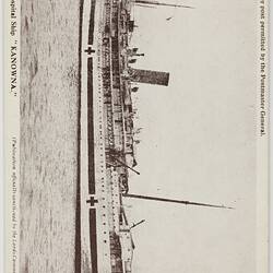Side view of ship at sea with medical crosses on hull.