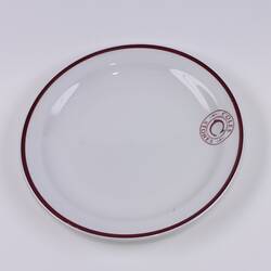 Ceramic plate with Coles Stores logo.