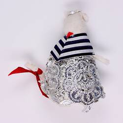 Back of  toy mouse with striped blue shawl.