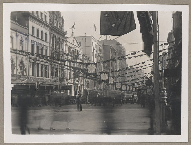 Monochrome photograph of decorated streets.