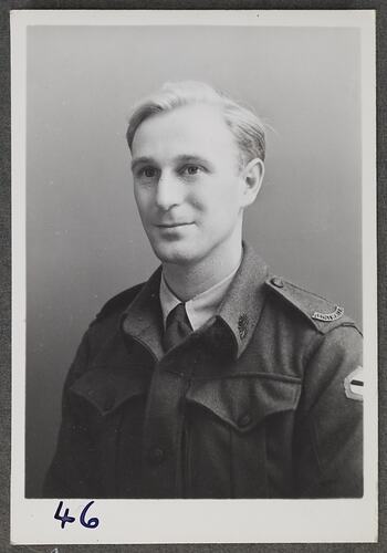 Studio portrait of man in military uniform.