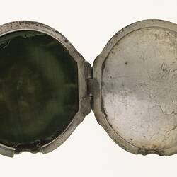 Gentleman's pocket watch case of silver and tortoise shell. Inside view.