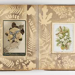 Open scrapbook showing 2 pages of floral motifs.