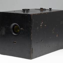 Side of wooden box camera.
