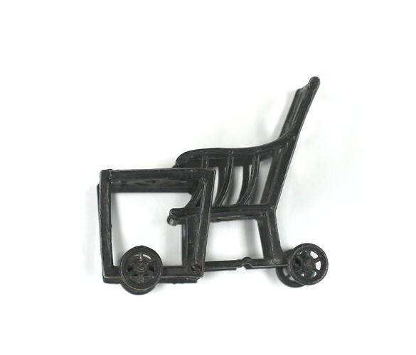 High chair converted to chair and table, side view.