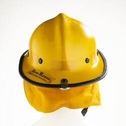 Back of yellow helmet with safety goggles and neck flap.