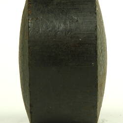 Black cylinder on side.