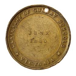 Round bronze medal with date in centre. Text around.