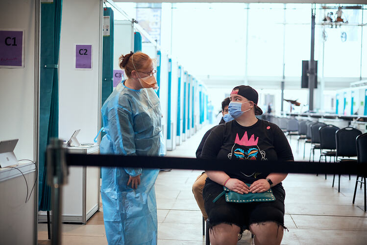 Lydia waits for Vaccination, St Vincent's Vaccination Hub, Melbourne Museum, 23 Sep 2021