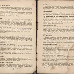 Open booklet with off-white pages and black printed text.