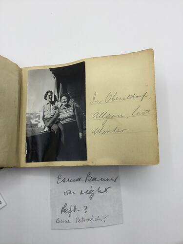 Black and white photo stuck in album with handwritten annotation in pencil along right.