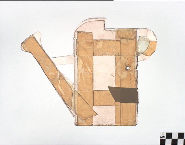 Thick, brown cardboard cut into watering can shape.