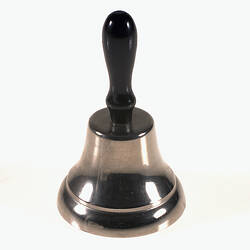 Bell with black handle.