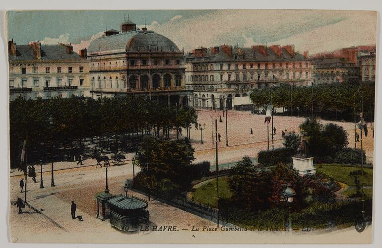 Urban streetscape with buildings and park.