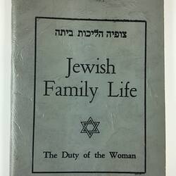Blue grey front cover of booklet with black printed text.