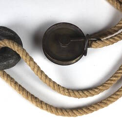 Detail of weights on rope.