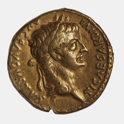 Round coin with male head facing right. Text around.