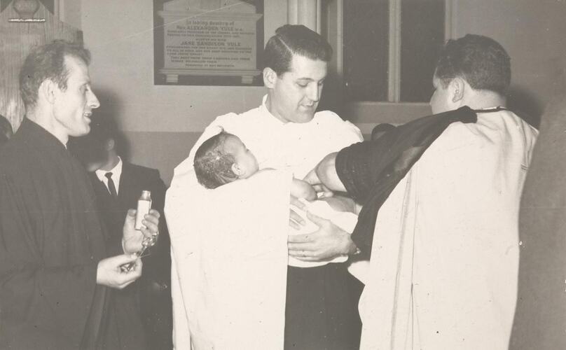 Digital Photograph - Baby Anointed with Holy Oil by Priest at Baptism, Carlton, circa 1964
