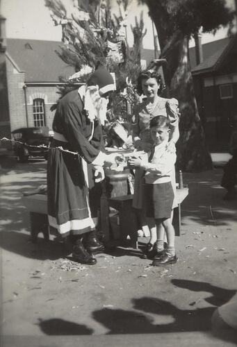 Digital Photograph - Father Christmas Giving Boy & Mother Presents, Family Christmas Party, South Yarra Primary School, 1945