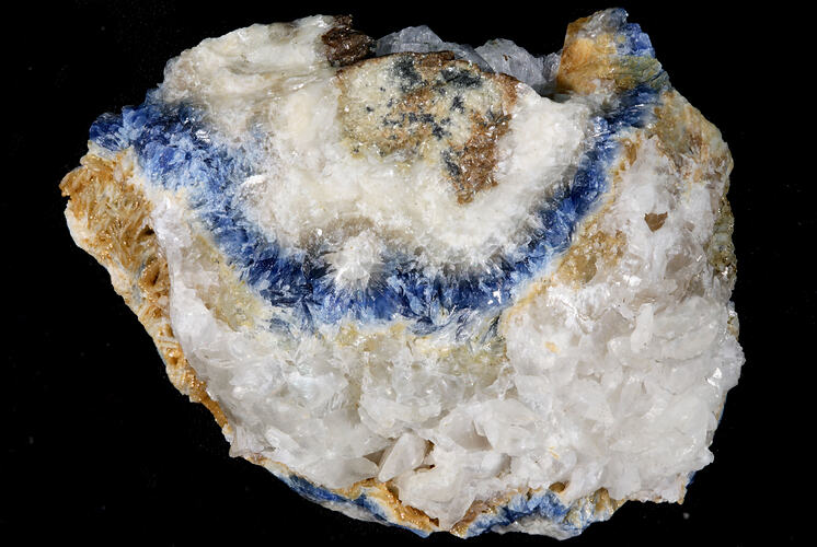 White crystals with band of bright blue.
