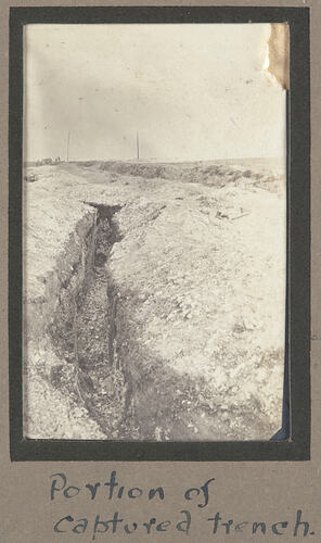 Trench with cleared terrain surrounding.