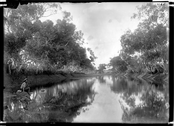 Baldwin Spencer sitting by the side of Attack Creek, Central Australia, 19 September 1901::Spencer and Gillen Collection