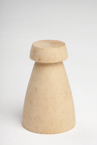 Wooden chess pawn from chess set.