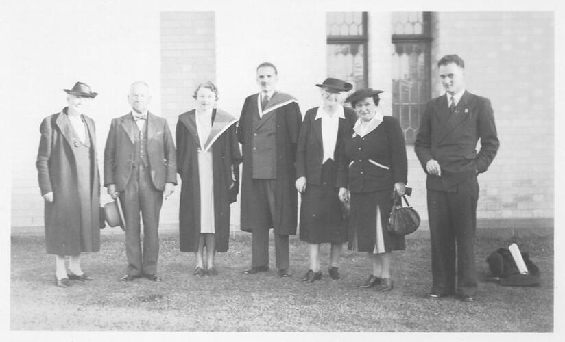 Photograph - Hope Macpherson after receiving her degree standing with six others, Melbourne University, 1946.