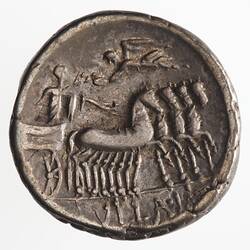 Round coin, aged, figure in chariot drawn by four horses, figure above holding a wreath.