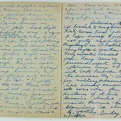Open book, 2 cream pages with faint grid pattern. Cursive handwritten text in blue ink. Page 12 and 13.