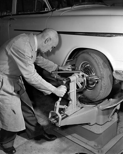 Royal Automobile Club of Victoria, Man Checking Tyres, St Kilda, Victoria, 27 May 1959