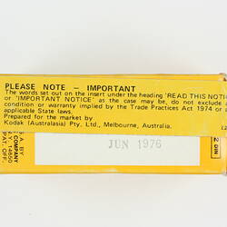 Film box with date stamp and sticker.